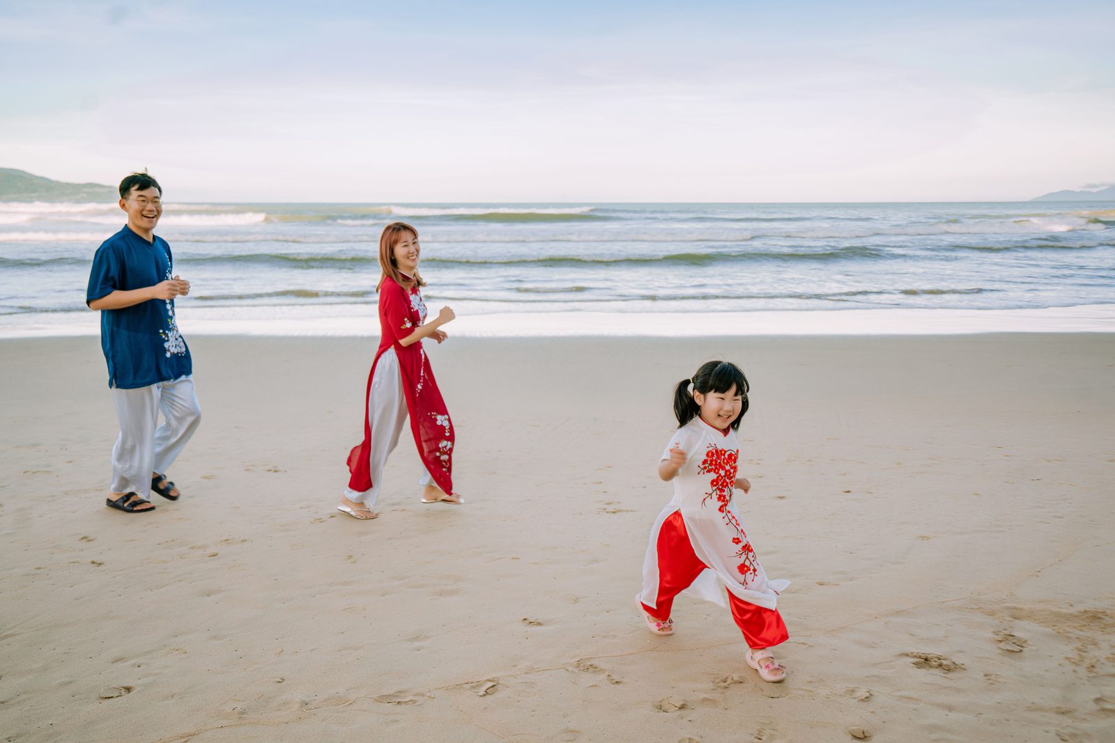 Family playing on the beach